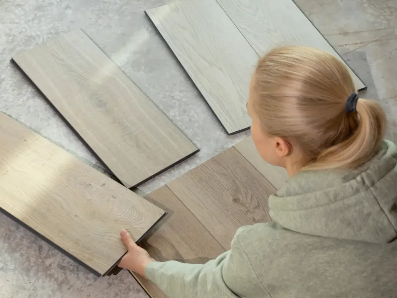 Home owner looking at eco-friendly flooring samples